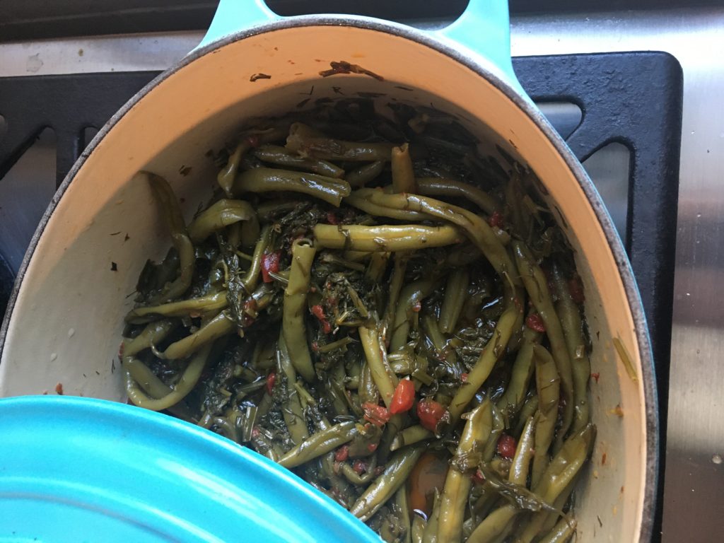 Greek-style green beans slow-cooked in olive oil