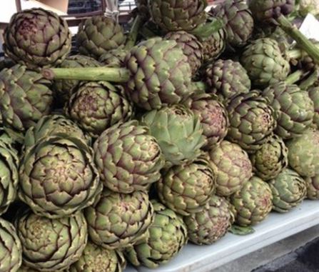 Stack of artichokes at a farm stand